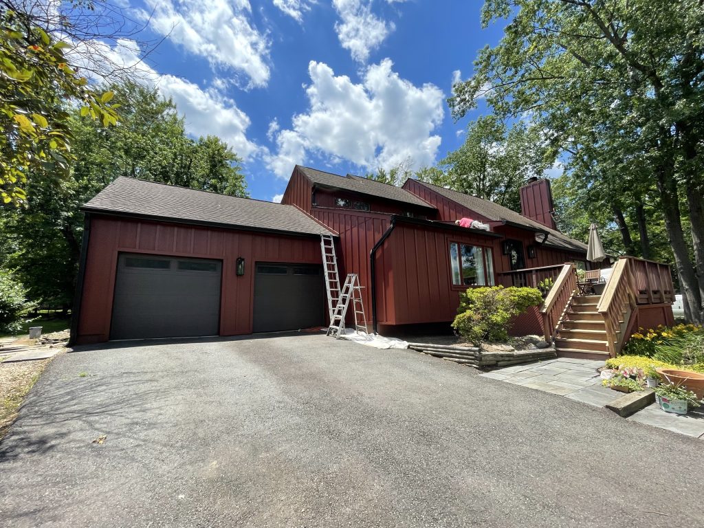 Home with new red hardie siding and trim by Macbeth Roofing in Culpeper Virginia