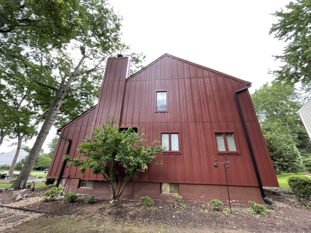 Home with new red hardie siding and trim by Macbeth Roofing in Culpeper Virginia