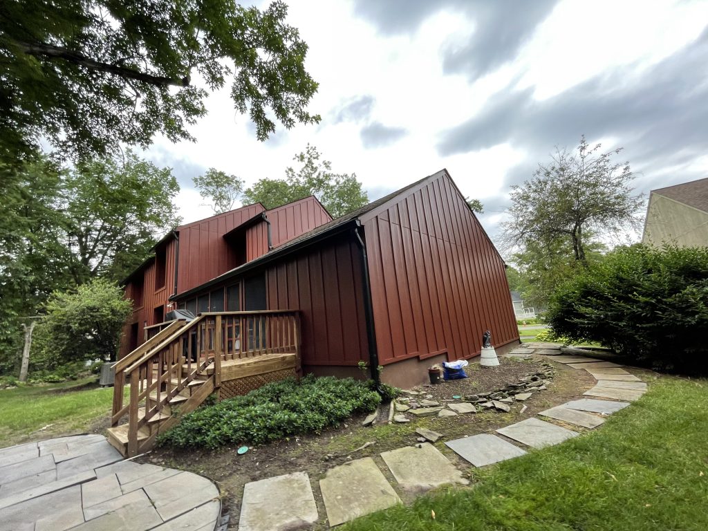 Home with new red hardie siding and trim by Macbeth Roofing in Culpeper Virginia